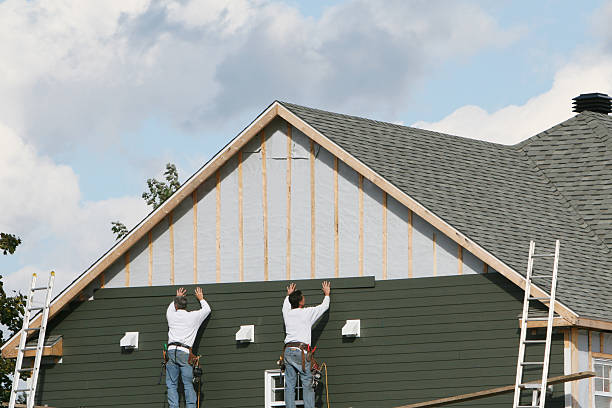 Professional Storm Damage Siding Repair technician working in Smithville, NJ